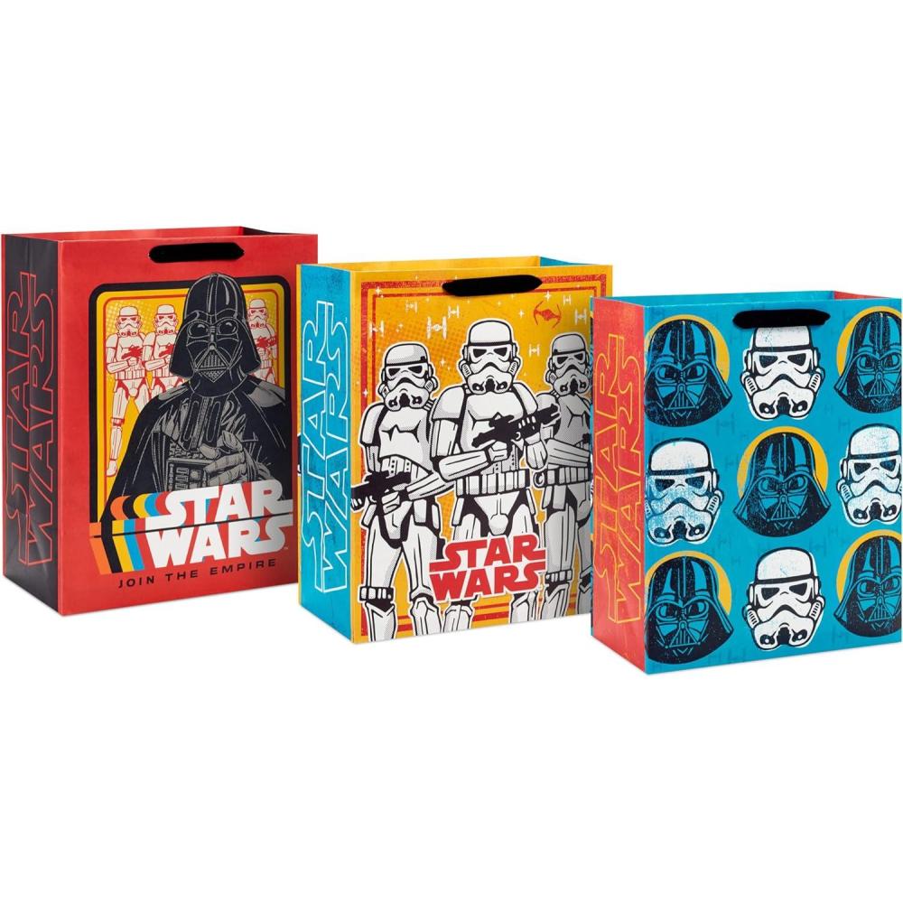 imageHallmark Star Wars Wrapping Paper with Cut Lines on Reverse 3Pack 60 sq ft ttl with Yoda Darth Vader Chewbacca R2D2 C3PO Stormtroopers XWing Millennium FalconGift Bags