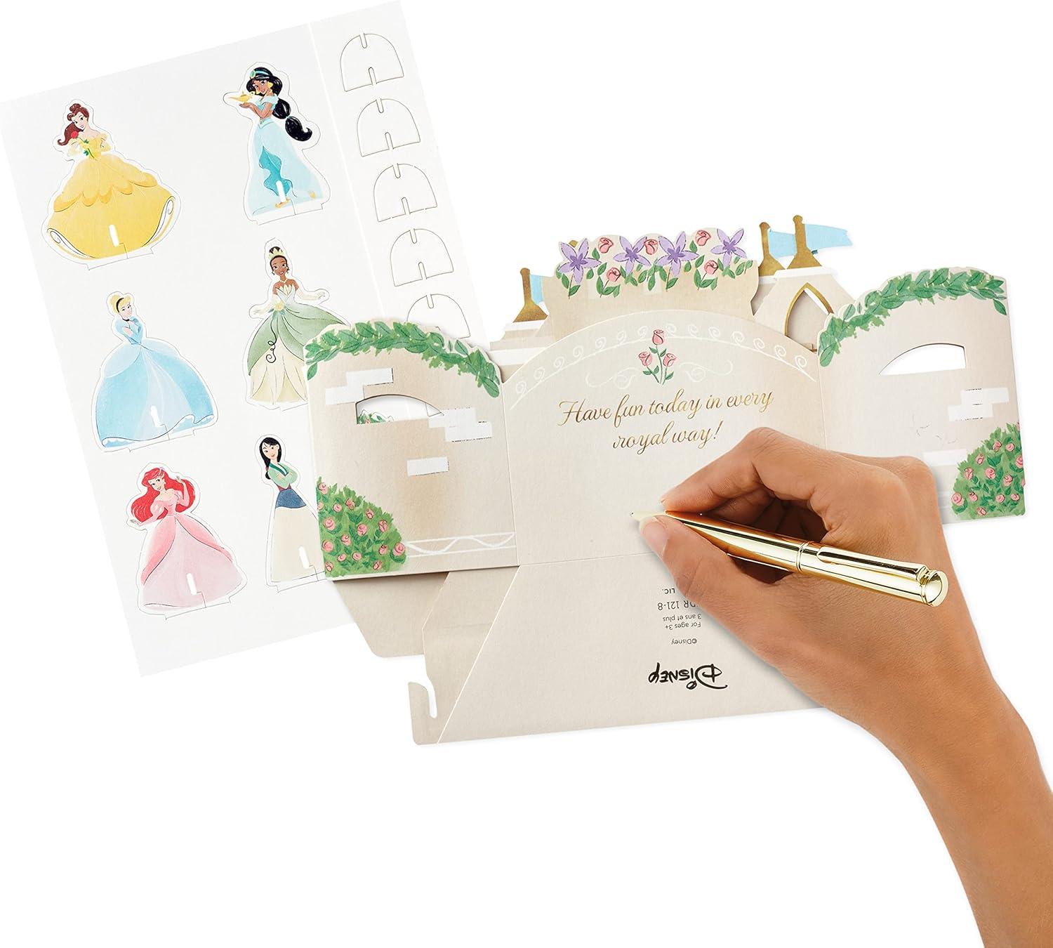 imageHallmark Paper Wonder Disney Princess Pop Up Birthday Card for Kids Ariel Cinderella Mulan Jasmine Belle TianaCastle Scene with Paper Princess Figures