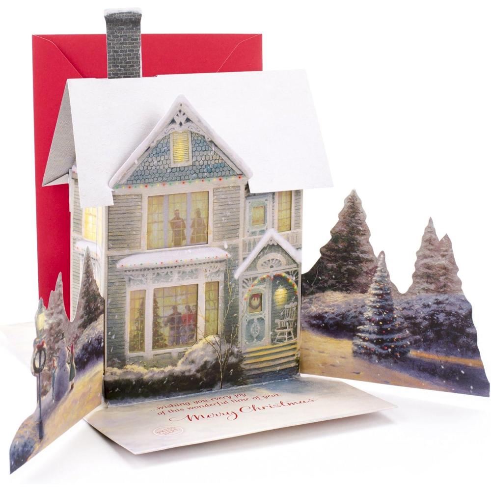 imageHallmark 0899XSO1002 Christmas Pop Up Card with Light and Song Displayable Dimensional Thomas Kinkade House Plays We Wish You a Merry Christmas Snowy House