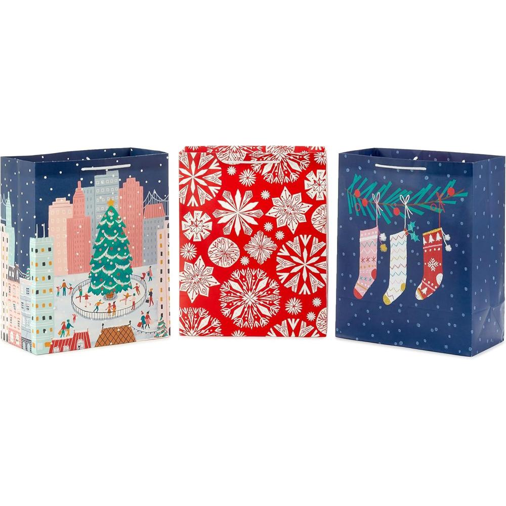 imageHallmark 13quot Large Cute Christmas Gift Bags 3 Bags Pink Stockings on Branch Paper Snowflakes Ice Skating in the City for Kids Teens Friends TeachersPink  Gray  Red