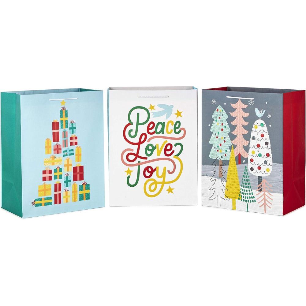 imageHallmark Assorted Christmas Gift Bag Bundle 3 Extra Large 17quot Gift Bags 3 Designs Trees Presents Peace Love Joy in Pink Yellow Mint Green Gray and White