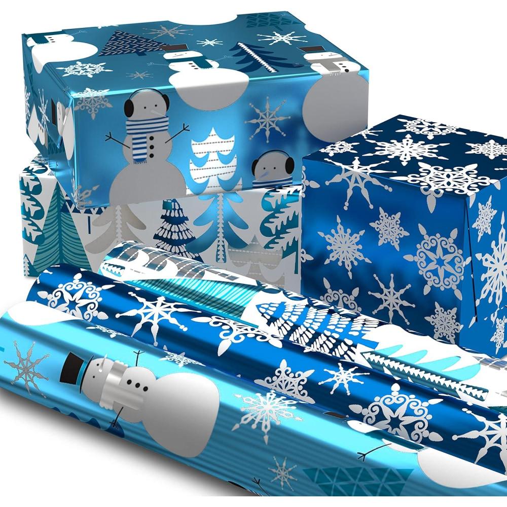 imageHallmark Blue Foil Christmas Wrapping Paper with Cut Lines on Reverse 3 Rolls 60 sq ft ttl Snowmen Snowflakes Christmas TreesBlue Snowman  Snowflakes  Trees