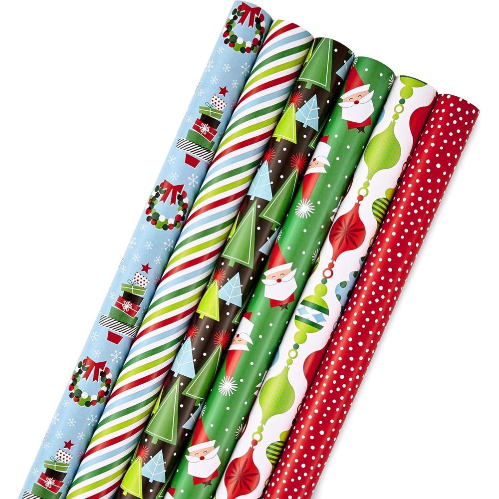 imageHallmark Reversible Christmas Wrapping Paper Rolls for Kids 6 Rolls 150 Sq Ft Total Cookies Donuts Mittens Penguins DinosaursModern Christmas