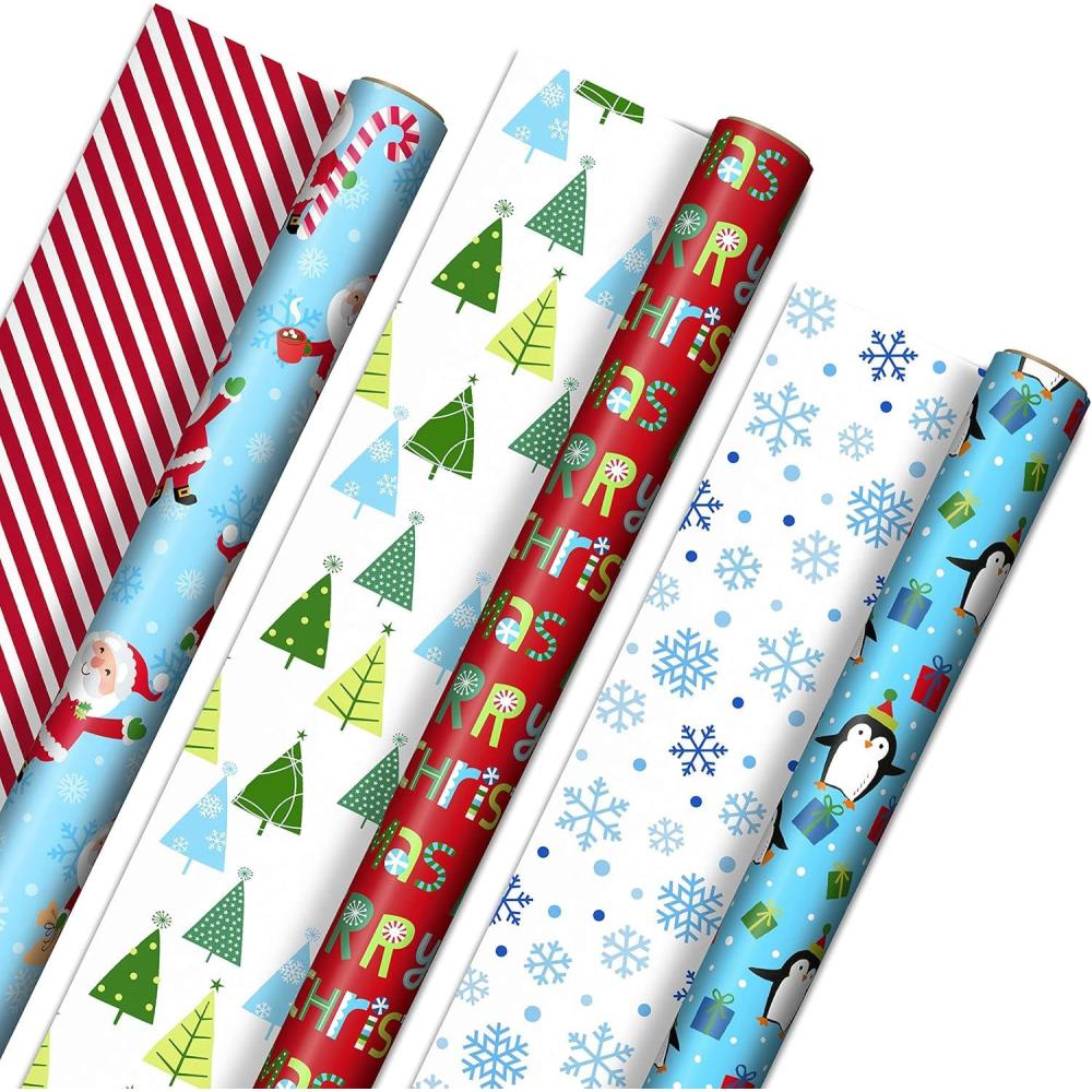 imageHallmark Trendy Reversible Christmas Wrapping Paper for Kids 3 Rolls 120 sq ft ttl Dinosaurs Koalas Polar Bears Penguins Camels Zebras StripesPenguins  Santa  Trees  Stripes  Snowflakes  Merry Christmas