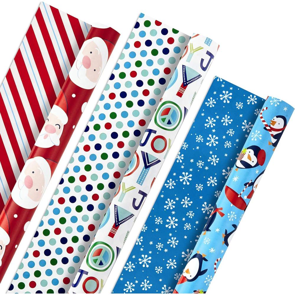 imageHallmark Trendy Reversible Christmas Wrapping Paper for Kids 3 Rolls 120 sq ft ttl Dinosaurs Koalas Polar Bears Penguins Camels Zebras StripesSanta  Joy  Penguins  Snowflakes  Polka Dots  Stripes