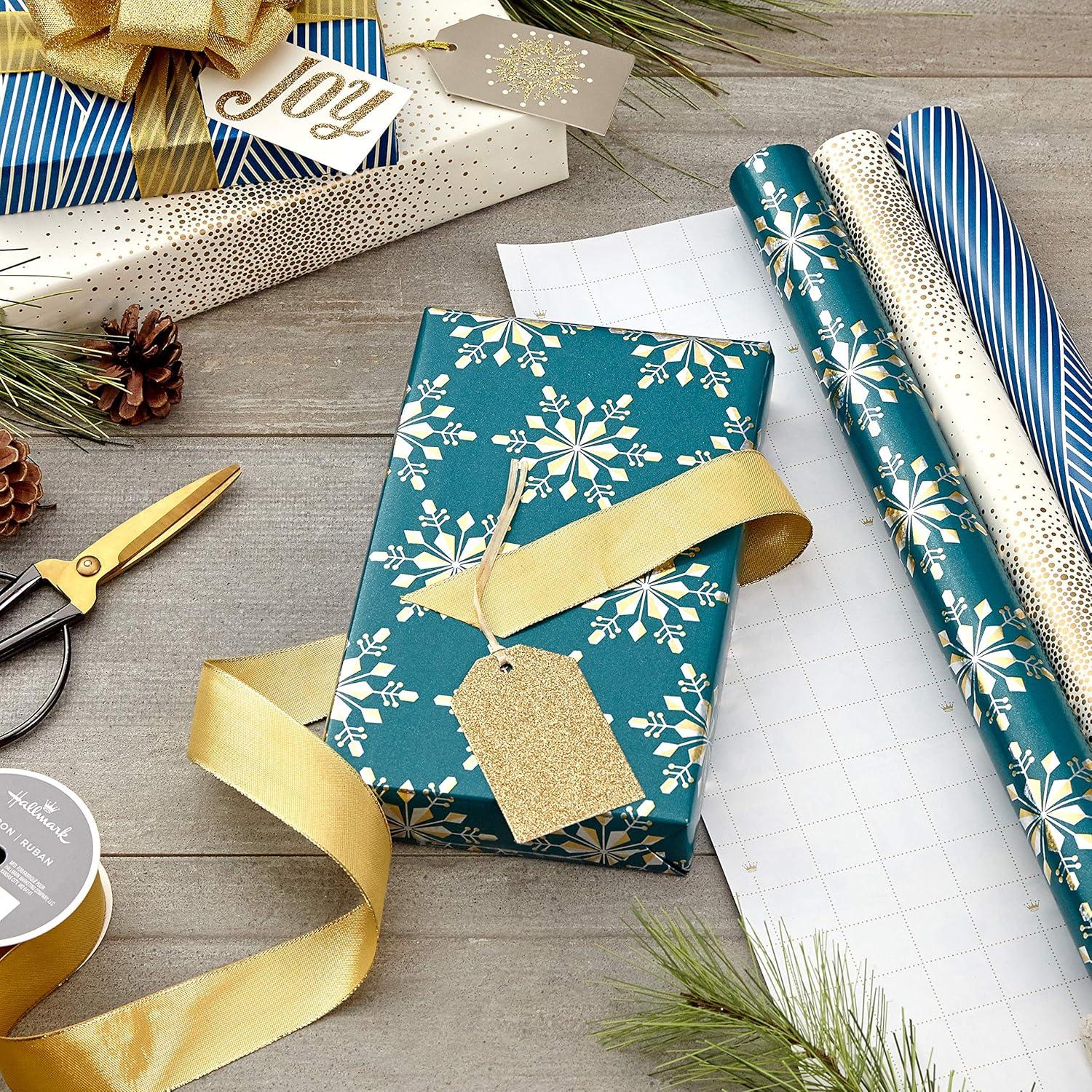 imageHallmark Holographic Holiday Wrapping Paper with Cut Lines on Reverse 3 Rolls 80 sq ft ttl Winter Glow Navy Blue Gold Holographic Snowflakes