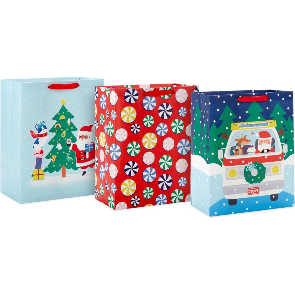 imageHallmark 13quot Large Christmas Gift Bags for Kids 3 Bags Santa and Puppy Santa in RV Colorful CandySanta Peppermints Driving Santa