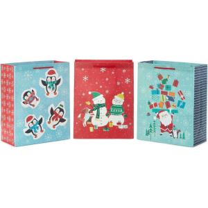 Hallmark 13″ Large Christmas Gift Bags for Kids (3 Bags: Santa and Puppy, Santa in RV, Colorful Candy)(Penguins  Snowman  Santa)