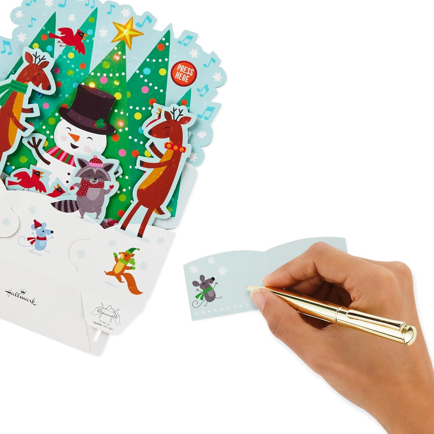 imageHallmark Paper Wonder Pop Up Christmas Card with Lights and Music Plays Rockin Around the Christmas TreeSnowman Plays Rockin Around the Christmas Tree