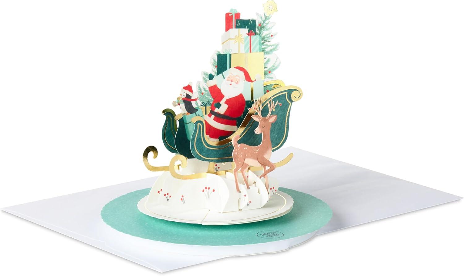 imageHallmark Paper Wonder Pop Up Christmas Card with Sound and Motion Spinning Santa in SleighSantas Sleigh