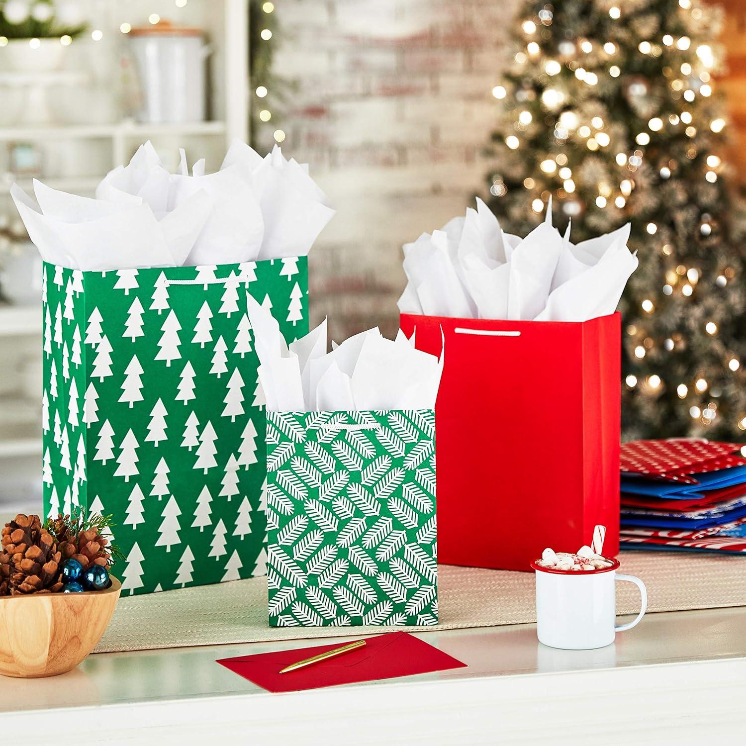 image:imageHallmark Christmas Gift Bags Assorted Sizes 12 Bags 5 Medium 8 4 Large 11 3 Extra Large 14 Red Blue Green Solids Snowflakes Stripes12 Piece Assortment